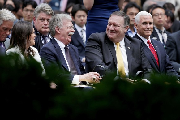 WASHINGTON, DC - JUNE 07: (L-R) White House Press Secretary Sarah Huckabee Sanders, National Security Advisor John Bolton, U.S. Secretary of State Mike Pompeo and Vice President Mike Pence share a lau ...