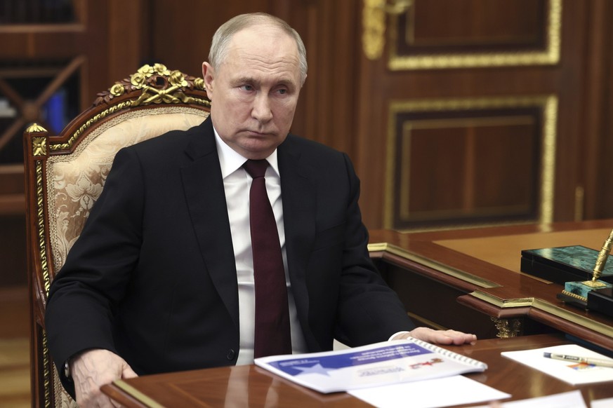 Russian President Vladimir Putin listens to Anna Tsivileva, a chairwoman of the Defenders of the Fatherland Foundation, at the Kremlin, Moscow, Russia, Tuesday, April 2, 2024. (Mikhail Metzel, Sputnik ...