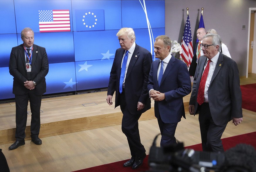 FILE - In this May 25, 2017 file photo, US President Donald Trump, center, speaks with European Council President Donald Tusk, second right, and European Commission President Jean-Claude Juncker in Br ...