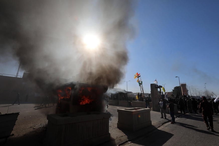 200101 -- BEIJING, Jan. 1, 2020 -- Protestors gather in front of the U.S. embassy in Baghdad, Iraq, on Dec. 31, 2019. Hundreds of demonstrators, participating in mourning for the Hashd Shaabi members  ...