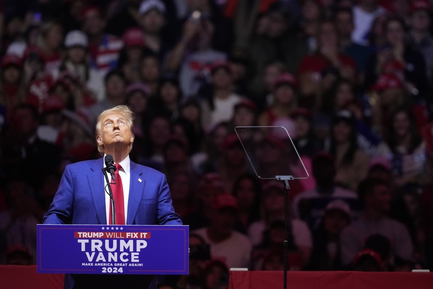 Republican presidential nominee former President Donald Trump looks at a video as he speaks at a campaign rally at Madison Square Garden, Sunday, Oct. 27, 2024, in New York. (AP Photo/Evan Vucci)