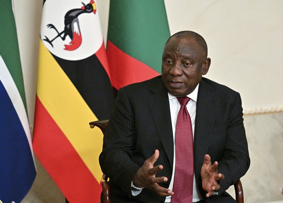 In this handout photo provided by Photo host Agency RIA Novosti, South African President Cyril Ramaphosa gestures while speaking to Russian President Vladimir Putin, not in photo, during their talks a ...