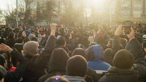 AKTAU, KAZAKHSTAN - JANUARY 4, 2022: People protest the liquefied petroleum gas price rise in Yntymak Square. The price that was raised on January 1, 2022, was lowered from $ 0.27 to 0.11 after a meet ...
