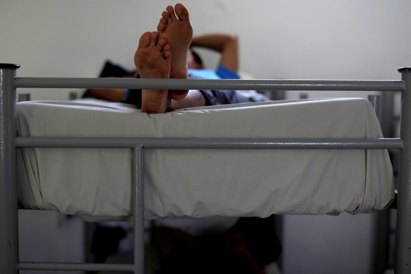 A man from Guatemala rests inside a migrant shelter in Matamoros, Mexico June 29, 2019. REUTERS/Carlos Jasso