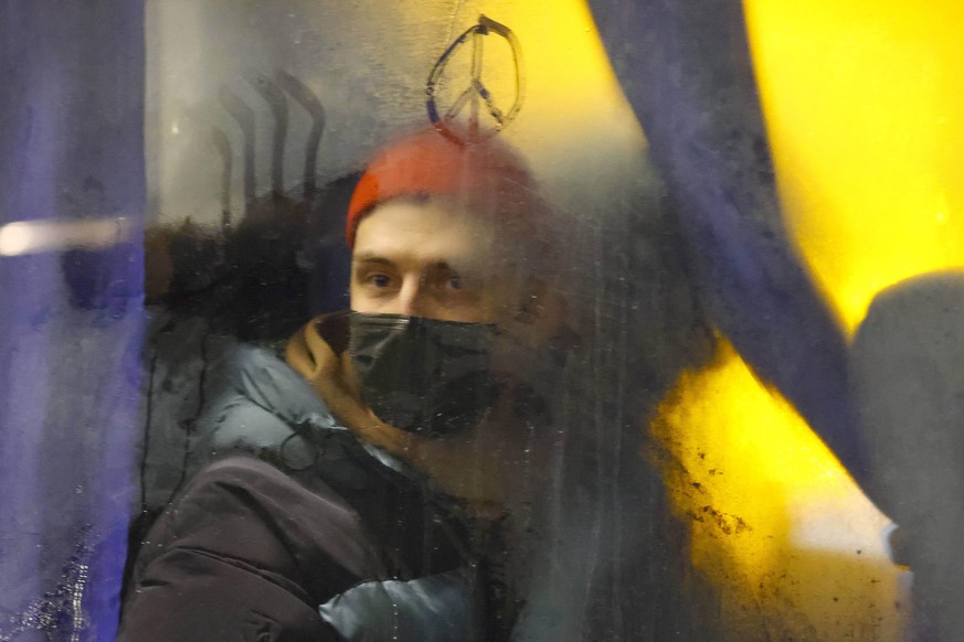 ST PETERSBURG, RUSSIA - FEBRUARY 24, 2022: A detained demonstrator looks from a police van during an unsanctioned anti-war protest in central St Petersburg. Early on 24 February, Russia s President Pu ...