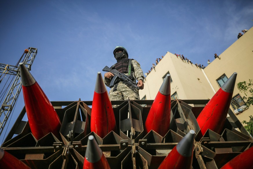 May 30, 2021, Gaza, Palestine: Members of the Ezz-Al Din Al-Qassam Brigades, the armed wing of the Hamas movement on a truck with rockets take part during the parade on the street in the northern Gaza ...