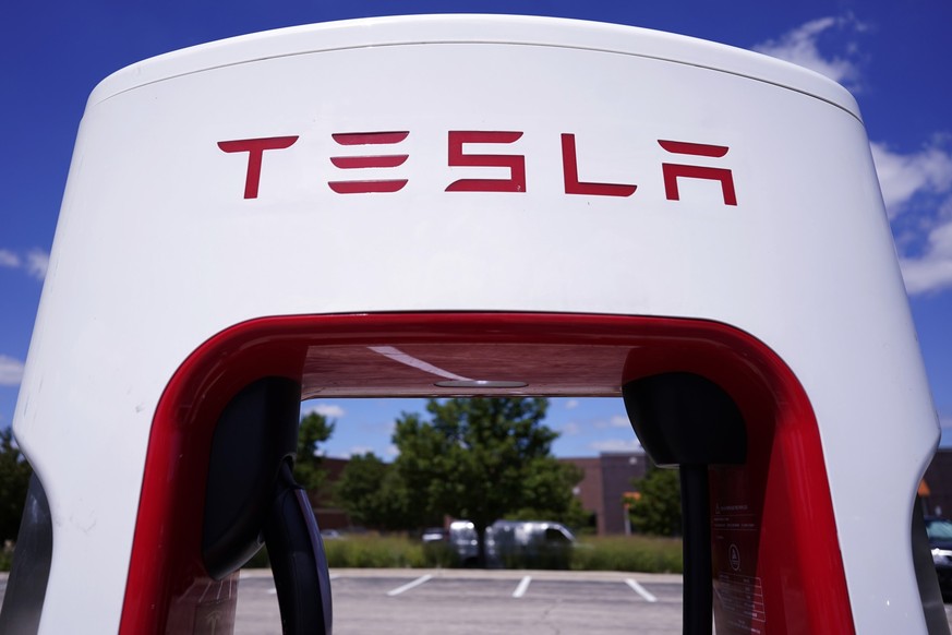 FILE - A Tesla Supercharger is seen at Willow Festival shopping plaza parking lot, Aug. 10, 2022, in Northbrook, Ill. On Monday, May 15, 2023, Delaware’s Supreme Court overturned a judge’s ruling upho ...