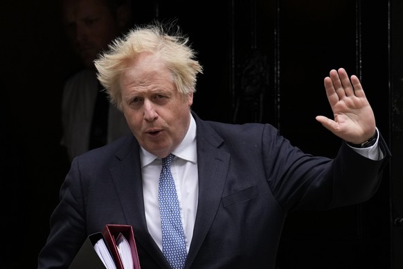 FILE - British Prime Minister Boris Johnson leaves 10 Downing Street to attend the weekly Prime Minister's Questions at the Houses of Parliament, in London, May 25, 2022. Former British Prime Minister ...