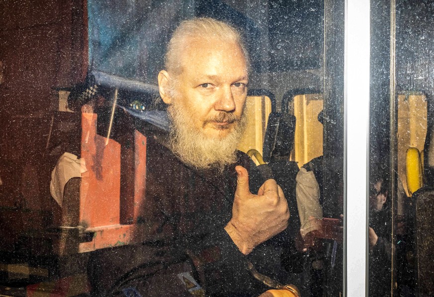 April 11, 2019 - London, London, UK - London, UK. Wikileaks founder Julian Assange arrives at Westminster Magistrates Court in a police escort to appear where he faces an extradition warrant. London U ...