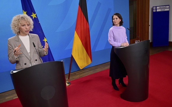 Former Greenpeace chief Jennifer Morgan, left, and German Foreign Minister Annalena Baerbock, right, address the media during a joint press conference in Berlin, Germany, Wednesday, Fe. 9, 2022. Germa ...