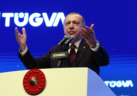 Turkey&#039;s President Recep Tayyip Erdogan addresses a meeting of a youth organisation founded by his elder son Bilal Erdogan and his friends, in Istanbul Saturday, Dec. 22, 2018. Erdogan said Frida ...