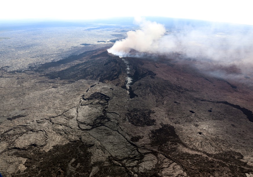 The Kilauea Volcano fissure that formed on the west flank of the Pu'u 'O'o cone (line of white steam) is seen in this aerial image after the volcano erupted following a series of earthquakes over the  ...