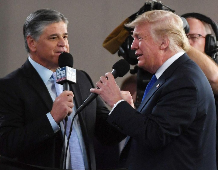 LAS VEGAS, NV - SEPTEMBER 20: Fox News Channel and radio talk show host Sean Hannity (L) interviews U.S. President Donald Trump before a campaign rally at the Las Vegas Convention Center on September  ...
