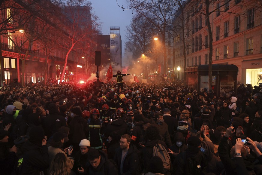 Protesters march during a rally in Paris, Thursday, march 23, 2023. French unions are holding their first mass demonstrations Thursday since President Emmanuel Macron enflamed public anger by forcing  ...