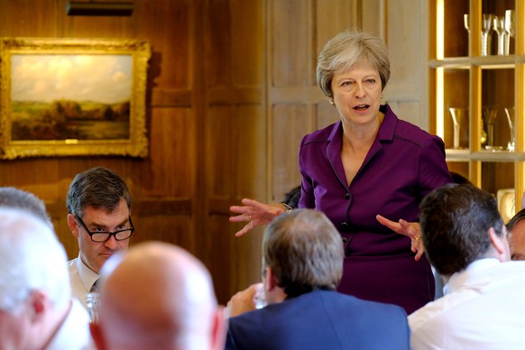 Britain's Prime Minister Theresa May commences a meeting with her cabinet to discuss the government's Brexit plans at Chequers, the Prime Minister's official country residence, near Aylesbury, Britain ...
