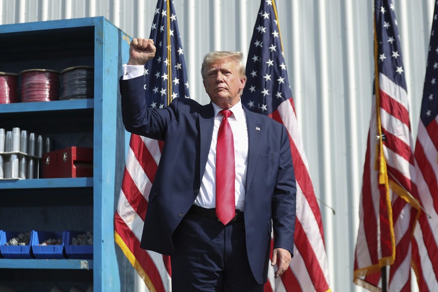 Former President Donald Trump ends his remarks and holds up his fist at a rally in Summerville, S.C., Monday, Sept. 25, 2023. (AP Photo/Artie Walker Jr.)