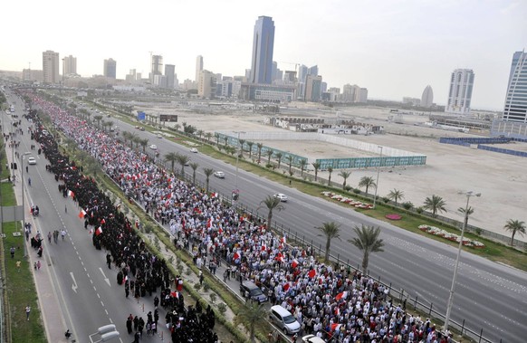 ARAB SPRING DAY 85: March 11, 2011 - Manama, Bahrain - Thousands of Bahraini anti-government demonstrators chant slogans against the king as they march toward the royal palace in Manama where a group  ...