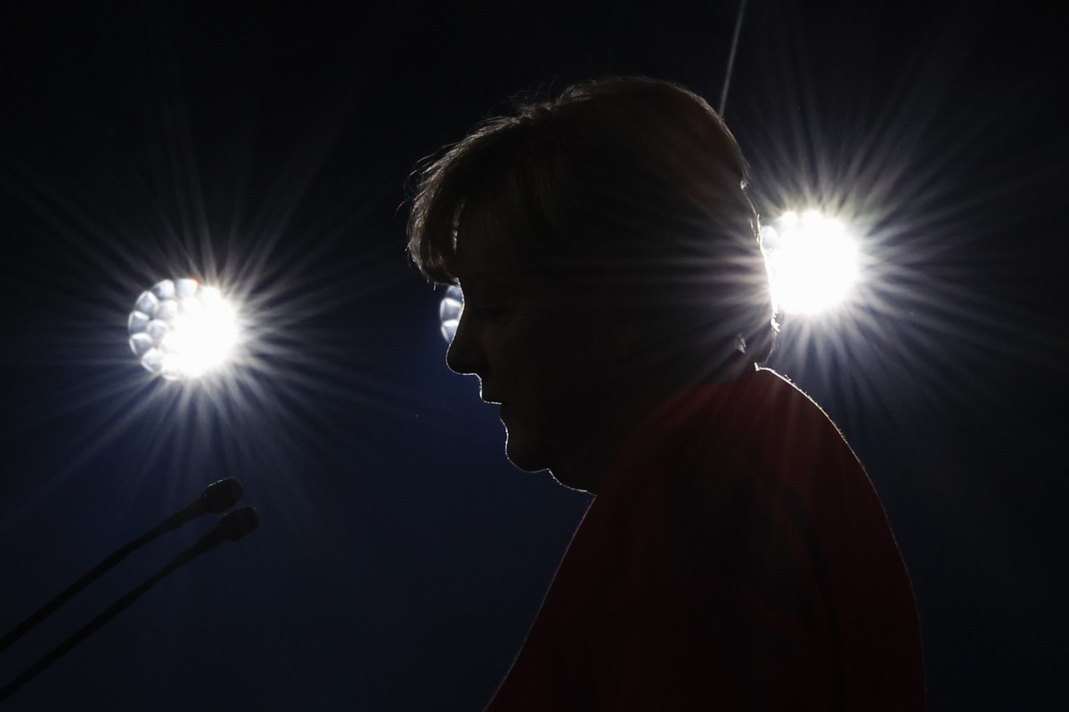 Angela Merkel speaks as she receives the UNHCR Nansen Refugee Award for protecting refugees at the height of the Syria crisis, during a ceremony in Geneva, Switzerland, Monday Oct. 10, 2022. (Stefan W ...