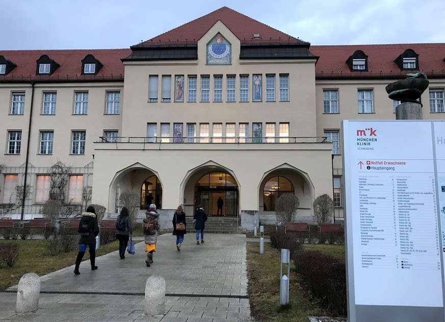 People walk towards the main entrance of Klinikum Schwabing, after Germany has declared its first confirmed case of the deadly coronavirus that broke out in China, in Munich, Germany January 28, 2020. ...