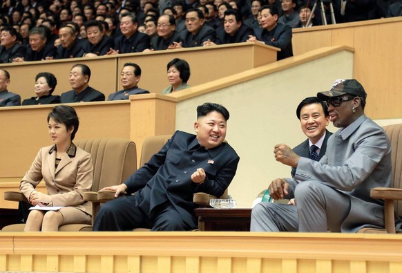 PYONGYANG, North Korea - Former U.S. basketball star Dennis Rodman (far R) and North Korean leader Kim Jong Un (3rd from R) chat while watching an exhibition basketball game between American and North ...