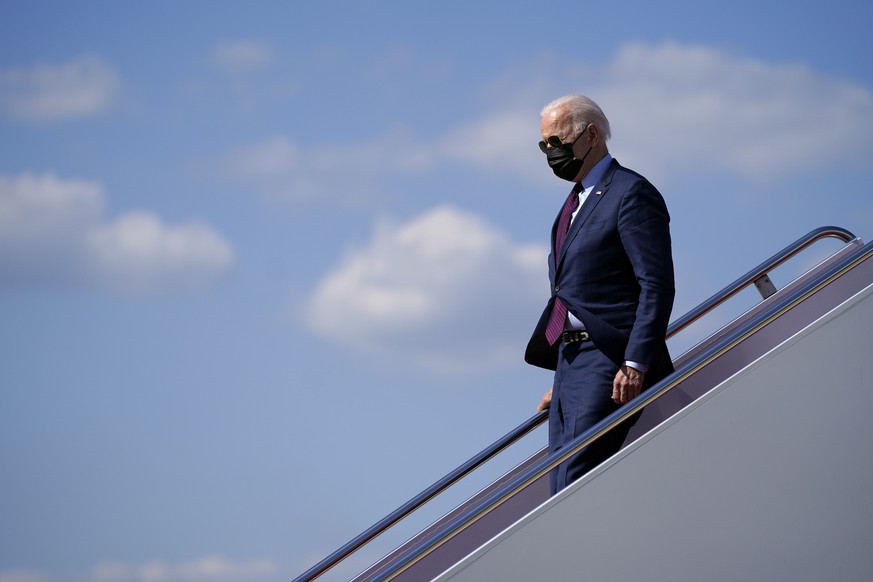 President Joe Biden arrives at Andrews Air Force Base after a trip to visit a Ford plant in Michigan, Tuesday, May 18, 2021, in Andrews Air Force Base, Md. (AP Photo/Evan Vucci)