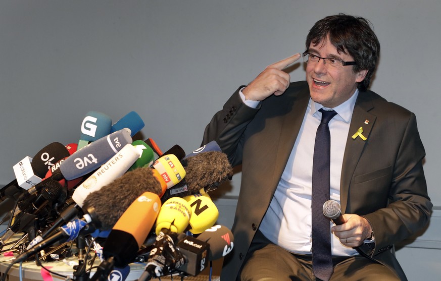 Former Catalan leader Carles Puigdemont gestures during a news conference in Berlin, Germany, Saturday, April 7, 2018. Puigdemont was released on bail from the prison in Neumuenster, northern Germany, ...