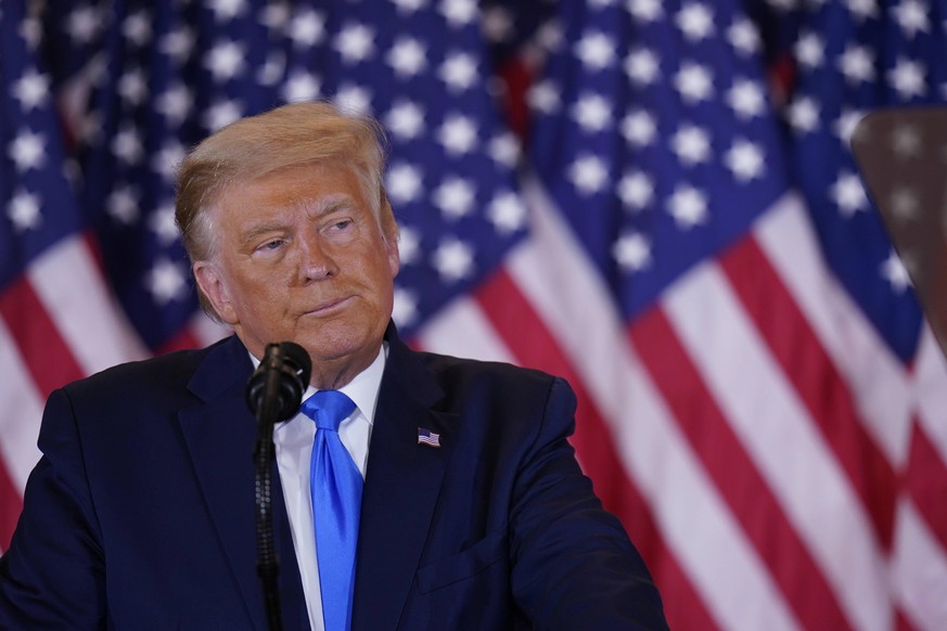 November 4, 2020, Washington, District of Columbia, USA: United States President Donald J. Trump makes a statement to the nation as his supporters look on in the East Room of the White House in Washin ...