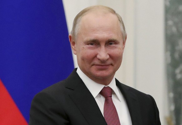 Russian President Vladimir Putin smiles as he attends an awarding ceremony in Moscow&#039;s Kremlin, Russia, Tuesday, Nov. 27, 2018. Putin and German Chancellor Angela Merkel spoke on the phone in the ...