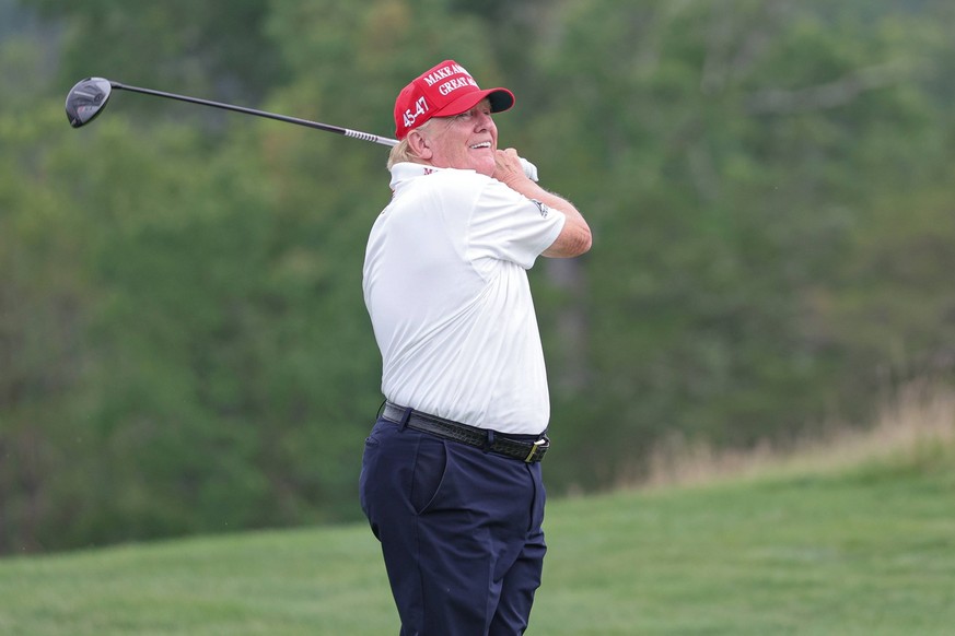 Golf: LIV Golf Bedminster - ProAm Round Aug 10, 2023 Bedminster, New Jersey, USA Former President Donald Trump plays his shot from the ninth tee during the ProAm round of the LIV Golf Bedminster golf  ...