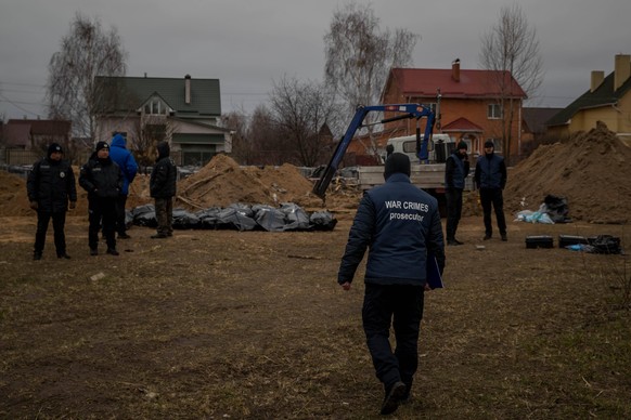 Corpses remain wrapped in plastic before authorities transfer them to the morgue, in Bucha, Ukraine, 13 April 2022. The withdrawal of Russian troops from the kyiv, Chernigov and Sumy regions has revea ...