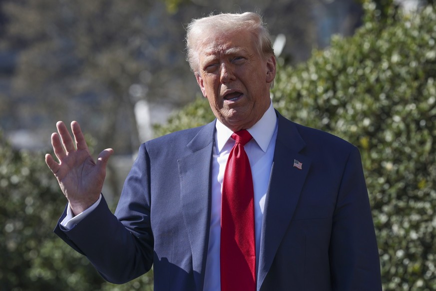 President Donald Trump speaks to reporters on the South Lawn of the White House Tuesday, March 11, 2025, in Washington. (Pool via AP)