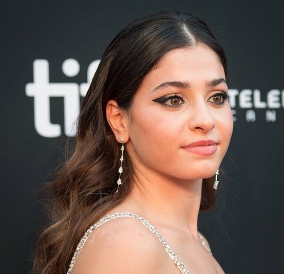 September 8, 2022, TORONTO, ON, CANADA: Yusra Mardini poses for a photograph on the red carpet for the film, The Swimmers, at Roy Thomson Hall during the Toronto International Film Festival on, Thursd ...