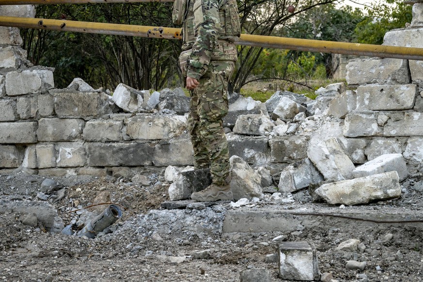 October 9, 2020, Martakert, Nagorno Karabakh: A soldier checks an azeri rocket nailed on the ground during the clashes between Azerbaijan and Nagorno Karabakh armies. Martakert Nagorno Karabakh - ZUMA ...