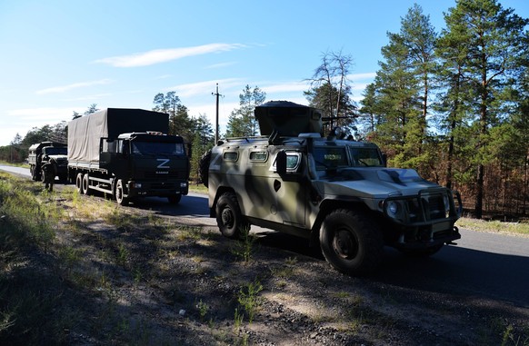 Ukraine Russia Military Operation Shelling 8266521 02.09.2022 The convoy of the Russian Special Forces vehicles drive down the street, as Russia s military operation in Ukraine continues, outside the  ...
