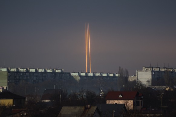 Three Russian rockets launched against Ukraine from Russia&#039;s Belgorod region are seen at dawn in Kharkiv, Ukraine, late Thursday, March 9, 2023. (AP Photo/Vadim Belikov)