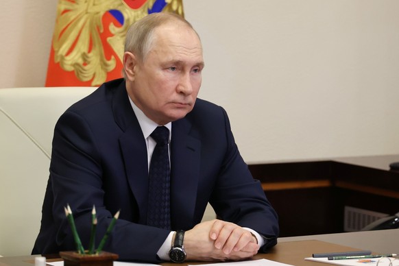 Russian President Vladimir Putin attends a videoconference with Russian Defense Minister Sergei Shoigu and Igor Krokhmal, commander of the frigate named &quot;Admiral of the Fleet of the Soviet Union  ...