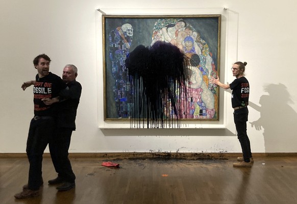 Austrian activists of &quot;last generation Austria&quot; have splashed a Gustav Klimt painting with oil in the Leopold museum in Vienna, Austria, Tuesday, Nov.15, 2022. The painting is behind a glass ...