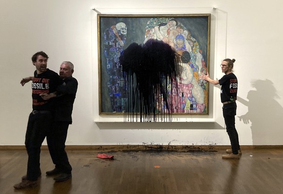 Austrian activists of "last generation Austria" have splashed a Gustav Klimt painting with oil in the Leopold museum in Vienna, Austria, Tuesday, Nov.15, 2022. The painting is behind a glass ...