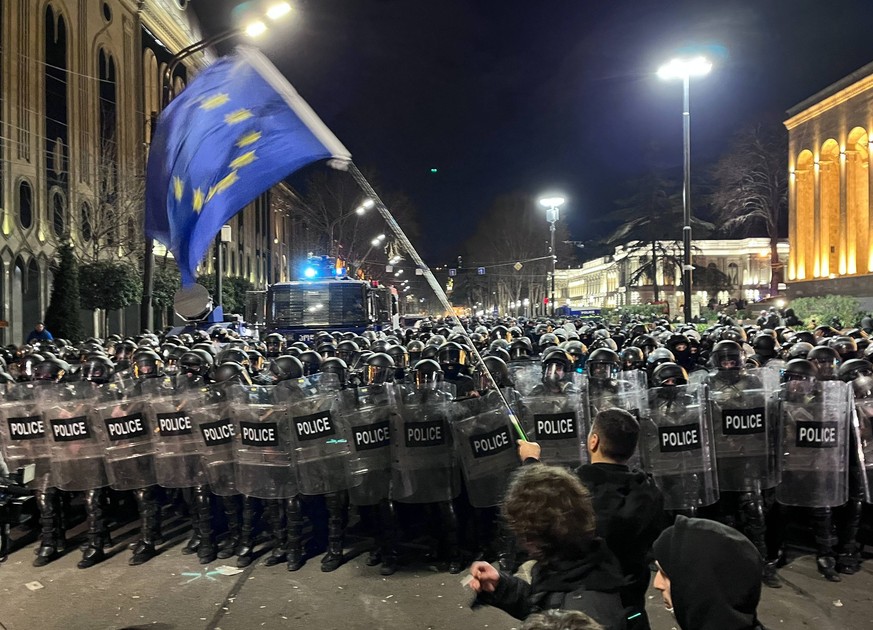 GEORGIA, TBILISI - MARCH 8, 2023: Police officers stand guard during a protest against a foreign agent bill passed by the Georgian parliament in the first reading on March 7. Thousands of protesters g ...