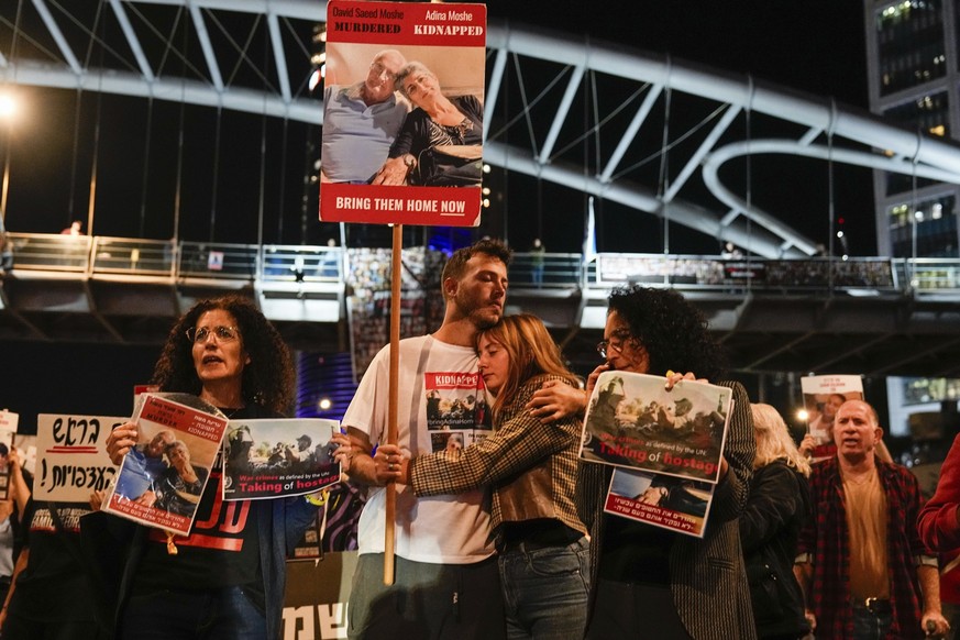 Families and friends of about 240 hostages held by Hamas in Gaza call for Israeli Prime Minister Benjamin Netanyahu to bring them home during a demonstration in Tel Aviv, Israel Tuesday, Nov. 21, 2023 ...