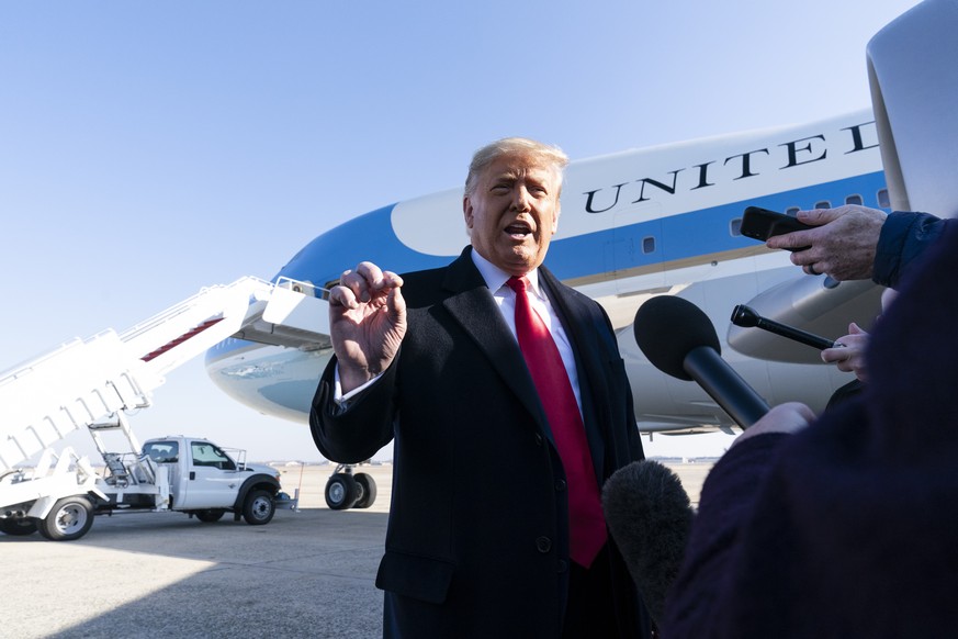 President Donald Trump speaks with reporters before boarding Air Force One upon departure, Tuesday, Jan. 12, 2021, at Andrews Air Force Base, Md. The President is traveling to Texas. (AP Photo/Alex Br ...