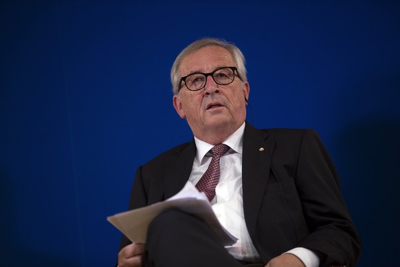 European Commission President Jean-Claude Juncker listens to Spain&#039;s Prime Minister Pedro Sanchez&#039;s speech before talking about the future of the European Union at the Carlos Amberes foundat ...