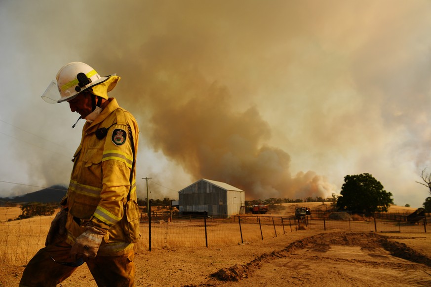 TUMURUMBA, AUSTRALIA - JANUARY 11: A Rural Fire Service firefighter Trevor Stewart views a flank of a fire on January 11, 2020 in Tumburumba, Australia. Cooler temperatures forecast for the next seven ...