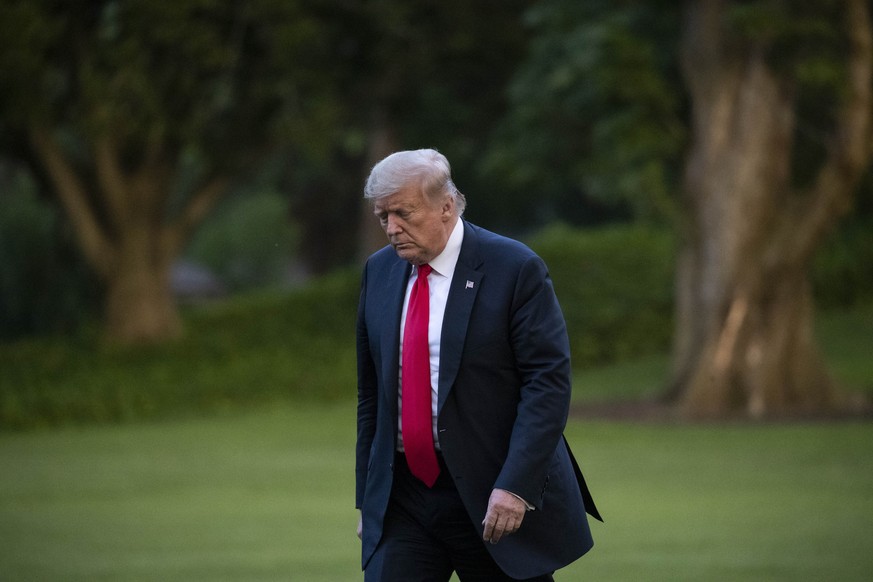 President Donald Trump walks on the South Lawn after arriving on Marine One at the White House, Thursday, June 25, 2020, in Washington. Trump is returning from Wisconsin. (AP Photo/Alex Brandon)