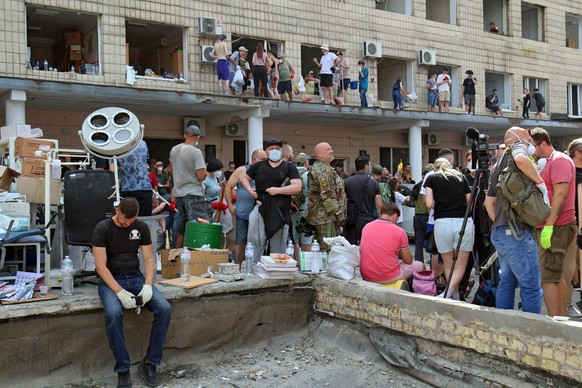 Children s Hospital Hit As Russian Strikes Kill Dozens - Kyiv People remove the rubble at the Ohmatdyt National Specialized Childrens Hospital attacked by Russias Kh-101 strategic cruise missile, Kyiv ...