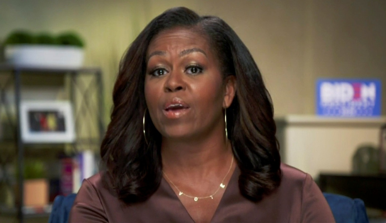 Former first lady Michelle Obama speaks in a frame grab from the live video feed of the all virtual 2020 Democratic National Convention as participants from across the country are hosted over video li ...