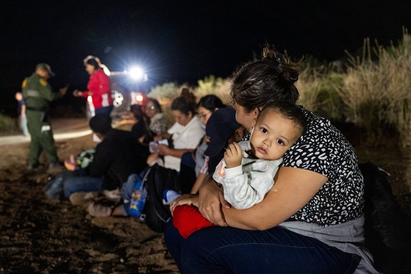 JACUMBA HOT SPRINGS, CA - JUNE 24: Migrants are processed by U.S. Border Patrol agents after crossing into U.S. from Mexico through an abandoned railroad on June 24, 2024 in Jacumba Hot Springs, San D ...