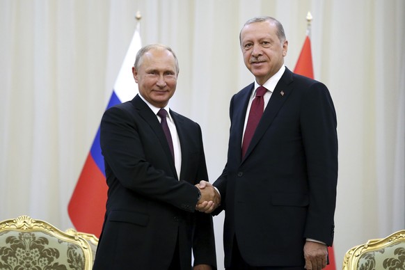 Turkey&#039;s President Recep Tayyip Erdogan right, shakes hands with Russia&#039;s President Vladimir Putin, in Tehran, Iran, Friday, prior to their talks, part of Russia-Iran-Turkey summit to discus ...