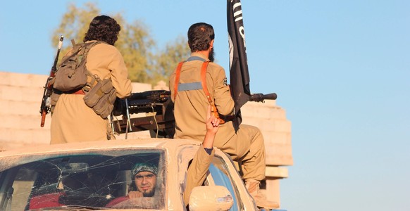 October 12, 2017 - Kobani, Aleppo Governorate, Syria - Undated ISIS propaganda image showing Islamic State fighters preparing for battle in Syria. Kobani Syria - ZUMAp138 20171012_zaa_p138_012 Copyrig ...