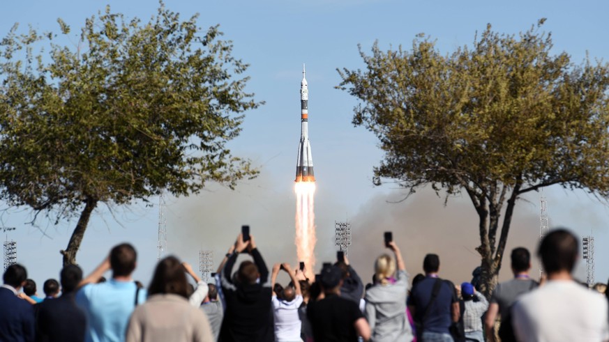 KAZAKHSTAN - OCTOBER 11, 2018: A Soyuz-FG rocket booster blasts off from the Baikonur Cosmodrome carrying the Soyuz MS-10 spacecraft with Roscosmos cosmonaut Alexei Ovchinin and NASA astronaut Nick Ha ...